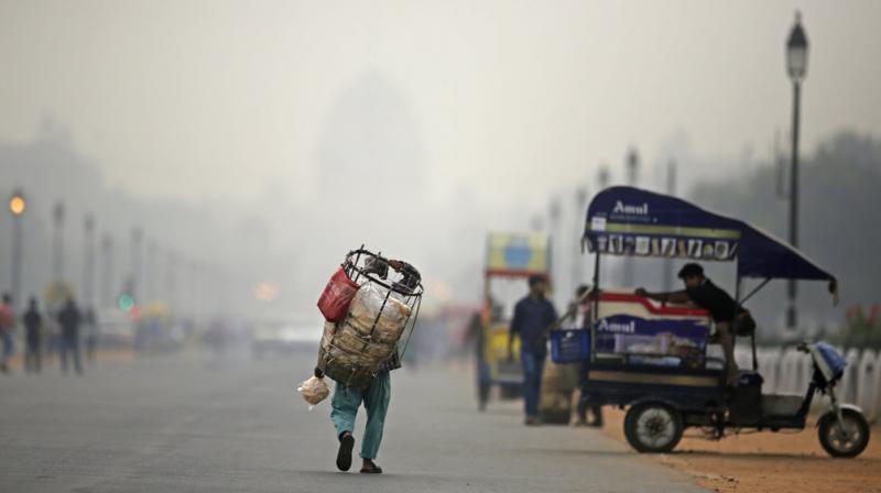 As cooler air traps pollutants close to the ground, Delhis levels of PM2.5 -- particles so tiny they can enter the lungs and bloodstream -- often soar to beyond 30 times the safe limit. (Photo: AP)