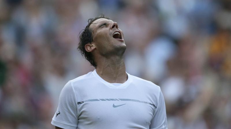 Rafael Nadal celebrates winning the Mens Single Match against Donald Young of the United States on day three at the Wimbledon Tennis Championships. (Photo:AP)