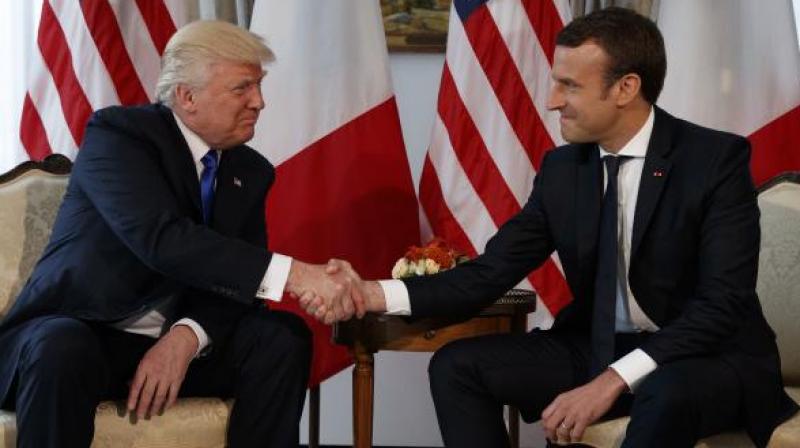 President Macron said he respected Trumps decision but France remained committed to the Paris accord. (Photo: AP)