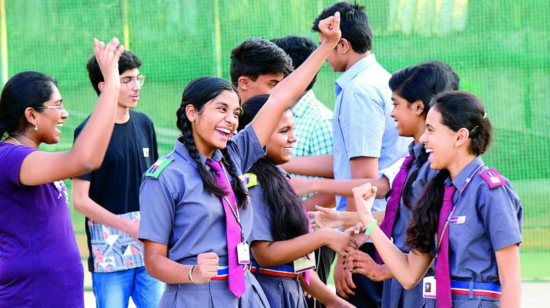 Students who have passed ICSE and ISC 12th standard from Johnson Grammer School, Nacharam celebrate on Monday.
