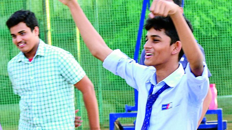 Johnson Grammer School students who passed class X and Class XII exams celebrate their success.