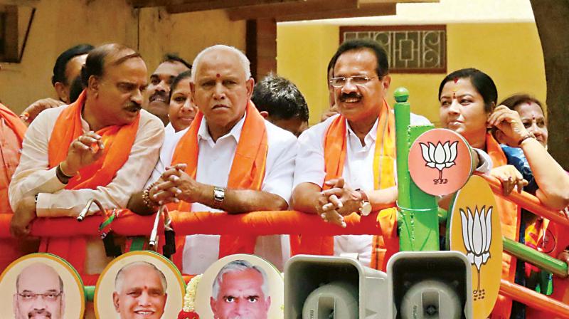 Union Ministers Ananth Kumar, Sadananda Gowda and BJP state president B.S. Yeddyurappa campaign for the party candidate B.N. Prahlad in Jayanagar on Thursday
