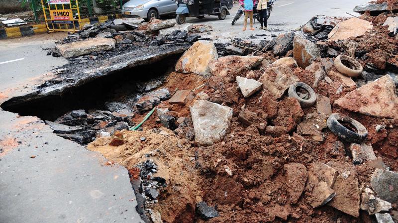 A road which caved in due to rain at Malleswaram 8th Main in Bengaluru 	Shashidhar B.