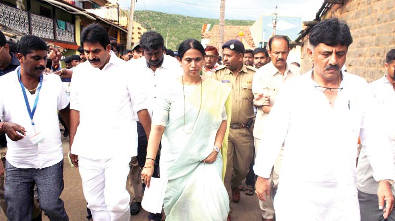 AICC general secretary in-charge of Karnataka K.C. Venugopal and state Mahila Congress chief Laxmi Hebbalkar participate in Mane Manege Congress programme in Belagavi on Sunday 	 KPN