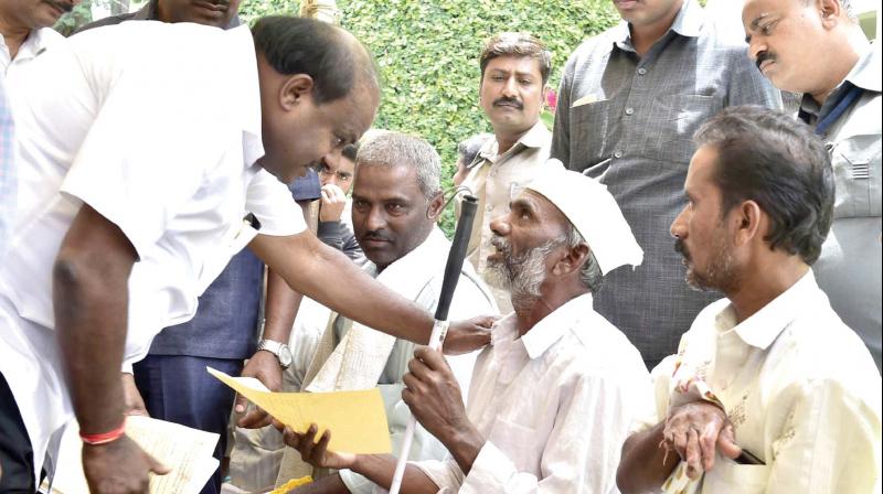 Chief Minister H.D. Kumaraswamy listens to the peoples grievances at the Janata Darshan programme in Bengaluru on Saturday 	 KPN