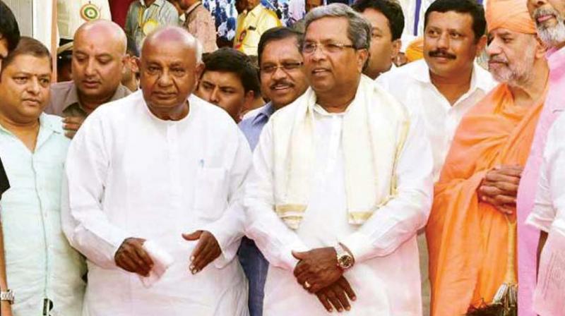 JD(S) supremo Deve Gowda and former CM Siddaramaiah in a file photo