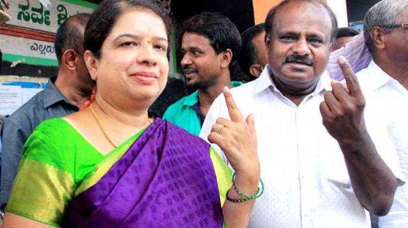 Chief Minister H.D. Kumaraswamy and wife Anita after voting in a recent poll