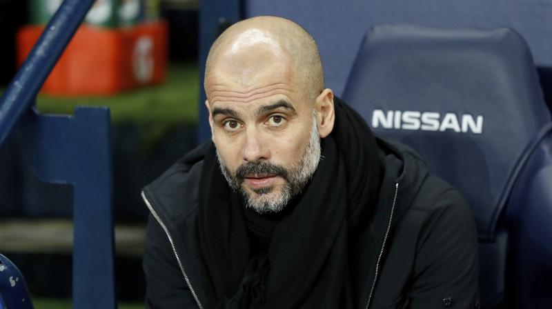 Pep Guardiola took a fresh dig at Neville by making a disparaging reference to his disastrous four-month spell as manager of Valencia in 2016.(Photo: AFP)