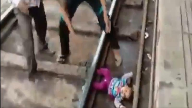 In the 30-second video clip, the infant, who can be seen crying, was rescued safely and handed over to the parents. (Photo: ANI/Twitter)