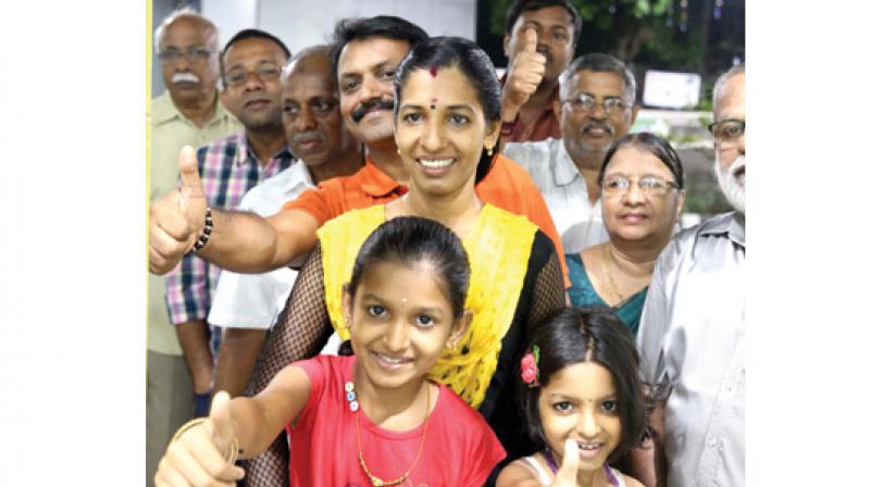 Girish Kumar and his family from Kakkanad were lucky to get the first tickets from Palarivattom Metro station. They stood in the queue for nearly an hour on Monday to get the tickets. (Photo: DC)