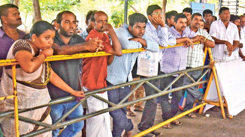 Parents eagerly wait for their wards to return after counselling in College of Engineering, Guindy, on Monday (Photo: DC)