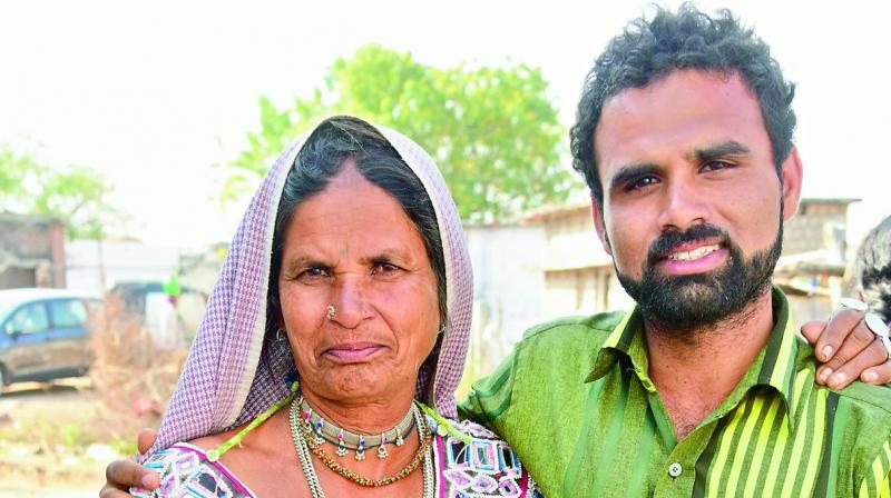 Islavath Lakshmi with her 19th child Mallesh, who is also her eldest son. She gave birth to 21 children.