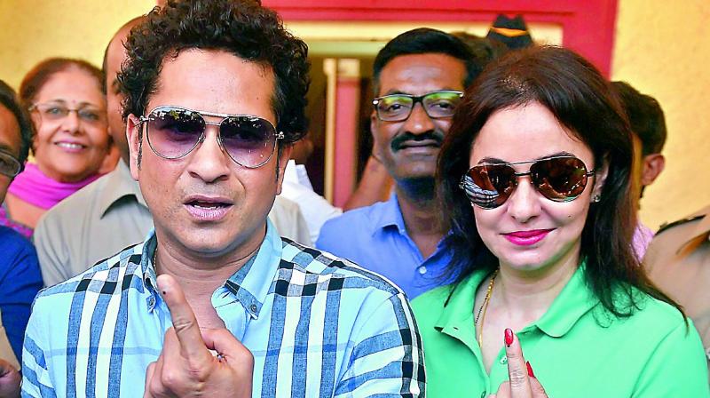 Cricket legend Sachin Tendulkar along with wife Anjali after voting for the municipal corporation election in Mumbai on Tuesday. (Photo: PTI)