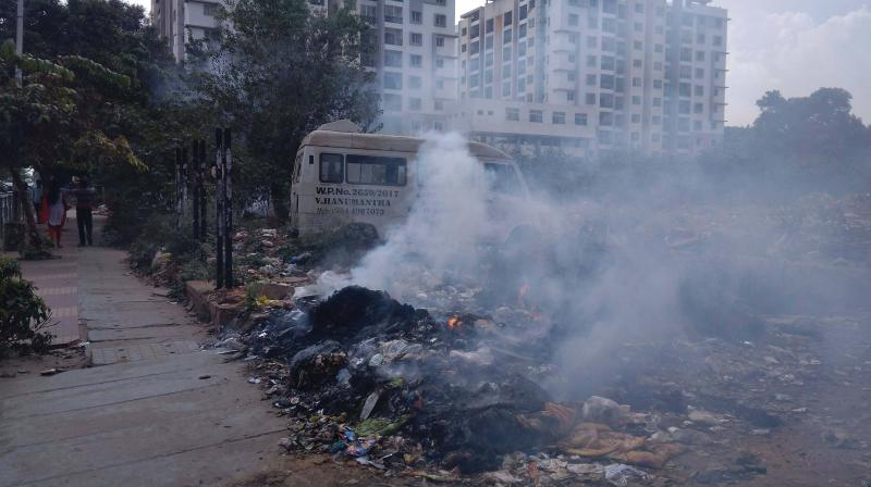 A coomon sight in BTM Layout where contractors dump garbage on a vacant spot and burn it