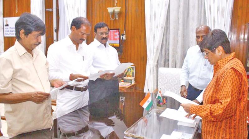 Lt Governor Kiran Bedi administers oath of office to three BJP members at Raj Nivas on Tuesday evening. Pondy Chief Minister  V. Narayanaswamy and cabinet colleagues were not present in the function. (Photo: DC)