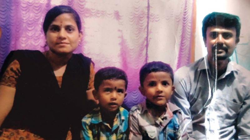 Sujatha  (26) with her two children Nakul (6) and Vishal (4) and husband Anjana Murthy.