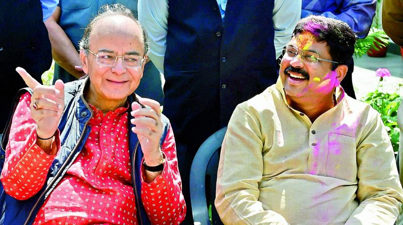 Finance minister Arun Jaitley and minister of petroleum and natural gas Dharmendra Pradhan during Holi celebrations  in New Delhi on Monday. (Photo: PTI)