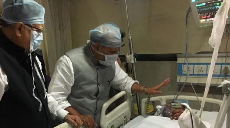 Home Minister Rajnath Singh and CM Raman Singh meet CRPF jawans injured in Sukma Maoist attack. (Photo: ANI/ Twitter)