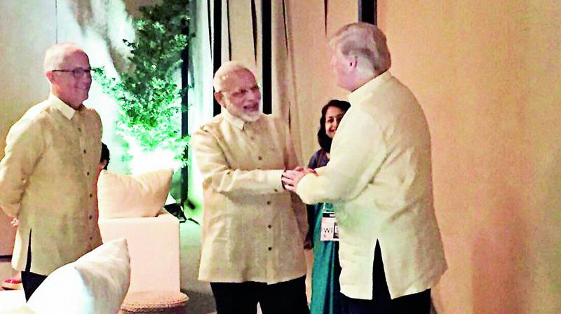 Prime Minister Narendra Modi with US President Donald Trump at an Asean Summit dinner in Manila on Sunday. (Photo: PTI)