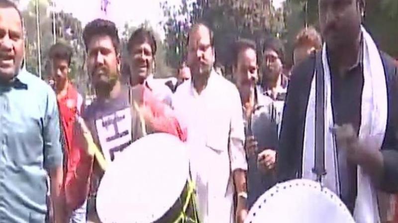 Congress workers celebrate outside MP Congress Committee office after partys win in Chitrakoot assembly bypoll. (Photo: ANI | Twitter)