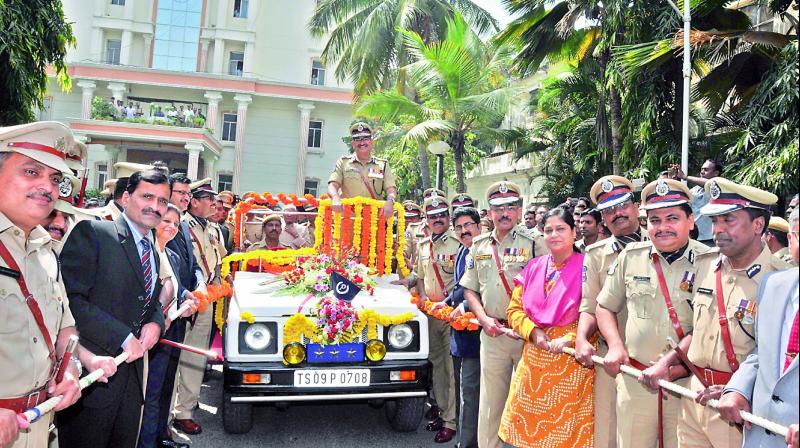 Senior police officials ceremonially pull a jeep with outgoing Director-General of Police Anurag Sharma to give him a farewell.  (Photo: P. Surendra)