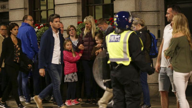 Officers have then responded to reports of stabbings in Borough Market, at the south end of the bridge. Armed officers responded and shots have been fired. police said.(Photo: AP)