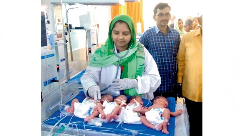 Ms. Shaik Shameena with her quadruplets, delivered at a hospital in Khammam on Thursday.