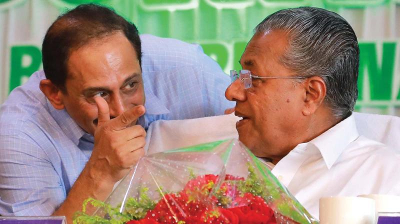 Chief minister Pinarayi Vijayan chats with CIAL managing director V.J. Kurian during the the inauguration of new terminal on Saturday. (Photo: ARUN CHANDRABOSE)