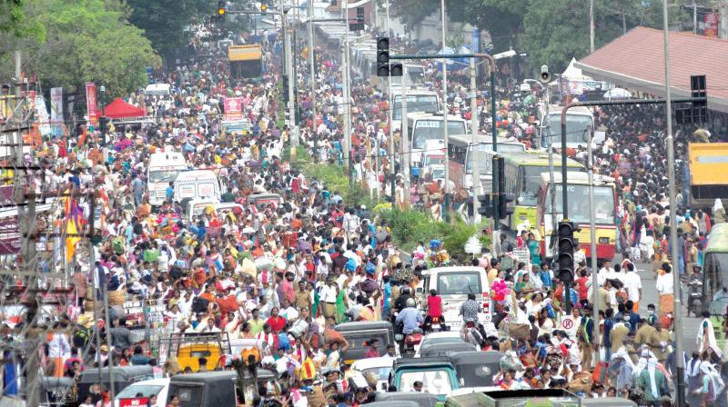 Devotees return after offering Pongala at Attukal temple in Thiruvananthapuram on Saturday. (Photo:  DC)