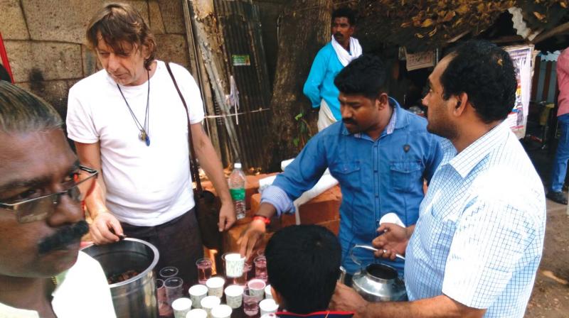 Jurgen Magin serves at an Annadanam counter in Thiruvanathapuram on Saturday. (Photo:  DC)