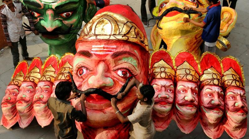 Workers busy in making effigies of the evil king Ravana at a workshop ahead of Dussehra festival in Nagpur, Maharashtra. (Photo: PTI)