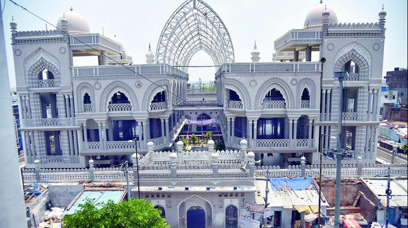The open courtyard of the Musheerabad Masjid (built in the 16th Century) houses two huge symmetrical structures and right above it are steel girders. (Photo:S. Surender Reddy)