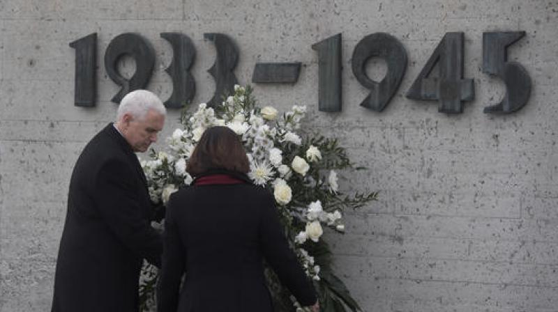 U.S. Vice President Mike Pence, left, and his wife Karen lay a wreath to commemorate the victims of the Nazi terror during a visit to the former Nazi concentration camp in Dachau near Munich. (Photo: AP)