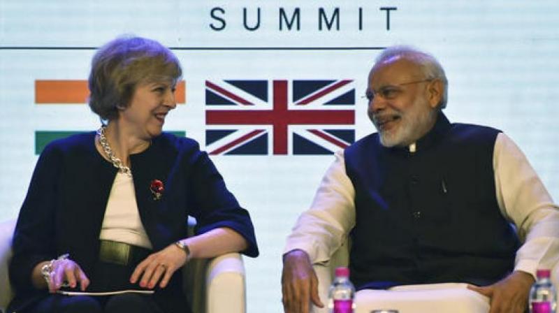 A file photo of British PM Theresa May with Indian PM Narendra Modi. (Photo: PTI)