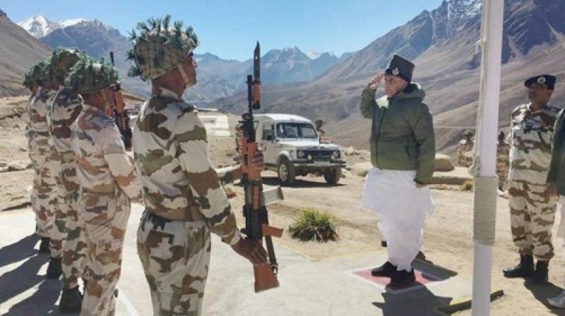 Union home minister, Rajnath Singh takes salute during his visit to ITBP Border Out Post (BoP) in Rimkhim Uttarakhand on Saturday. (Photo: PTI)