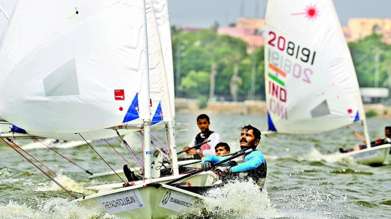 Shekhar Yadav of Maharashtra wins the first race in the Telangana State Sailing Championship Radial Open Class at the Hussainsagar lake on Sunday.