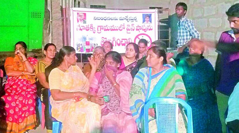 Women of Nuttaki village protest  against the liquor shops in the village in Guntur district on Sunday. (Photo: DC)