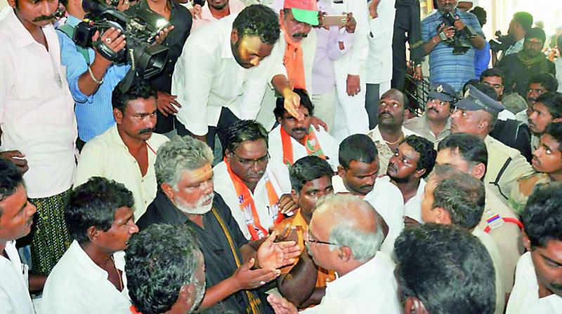 BJP leaders and workers argue at the Town Hall in Nellore on Wednesday. (Photo: DC)