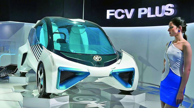 A model showcases Toyotas FCV Plus concept car during Auto Expo 2018 in Greater Noida on Wednesday. (Photo: Biplab Banerjee)