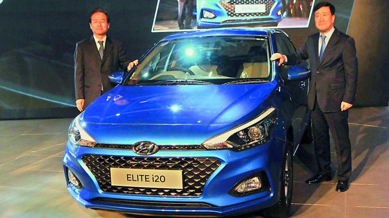 Hyundai Motor India MD and CEO YK Koo with Elite i20 at Auto Expo in Greater Noida. (Photo: DC)