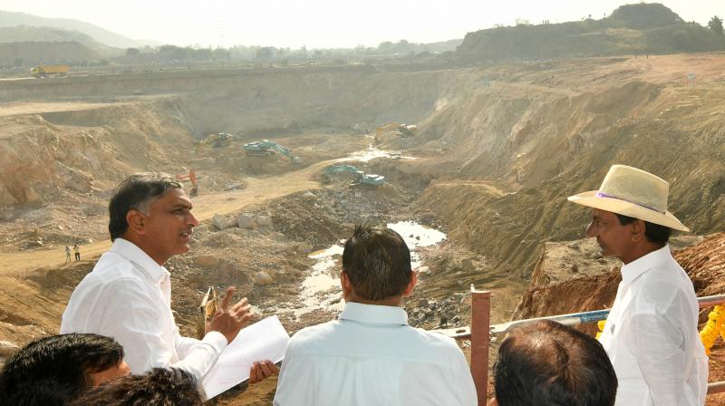Minister T. Harish Rao briefs Chief Minister K. Chandrasekhar Rao on work at a work site which is part of the larger Kaleswaram project, on Friday.