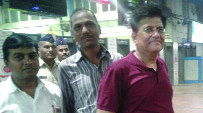 Union railway minister Piyush Goyal (right) at Churchgate station with WR staff on Saturday.