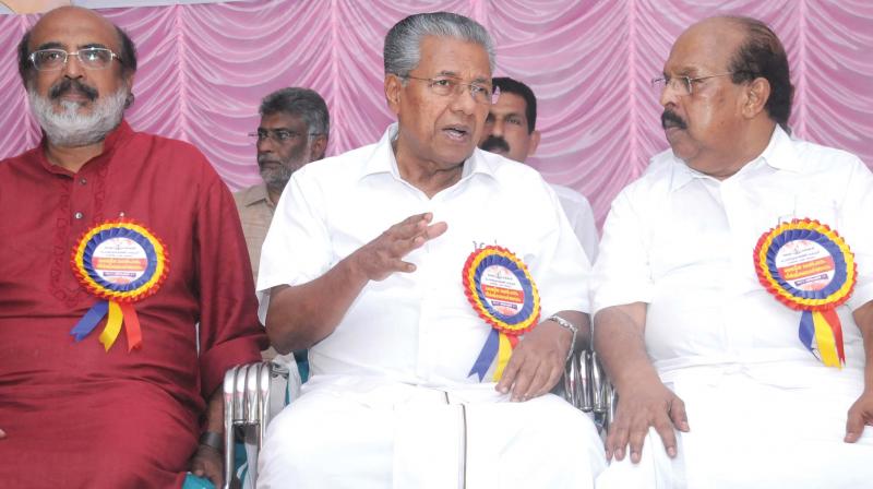 Chief minister Pinarayi Vijayan with Finance Minister Thomas Isaac and Minister for Public Works G. Sudhakaran during the inauguration of Vyttila flyover work in Kochi on Monday.