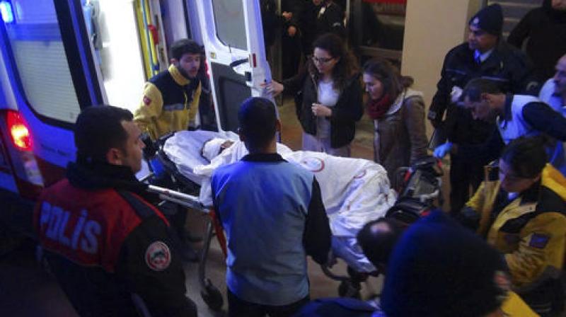 Paramedics carry a victim of a car bomb attack at a hospital in Viransehir, Turkey. (Photo: AP)