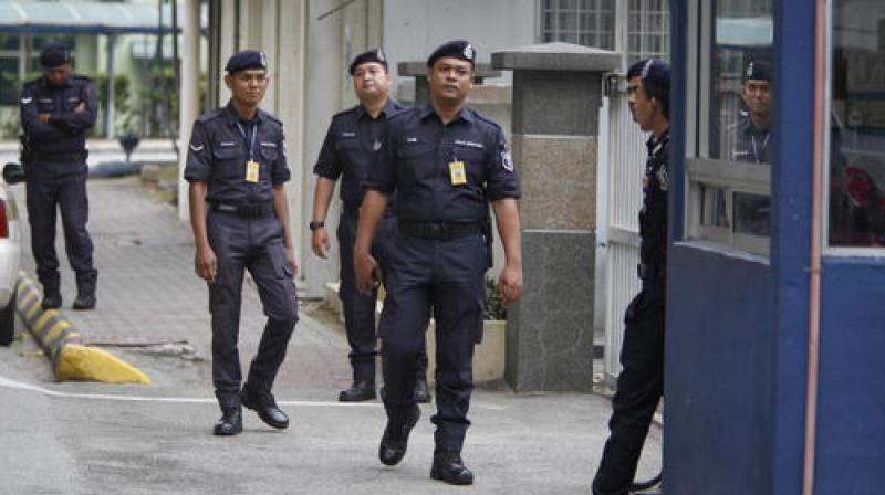 Police officers patrol outside the forensic department at Kuala Lumpur Hospital in Kuala Lumpur, Malaysia. (Photo: AP)