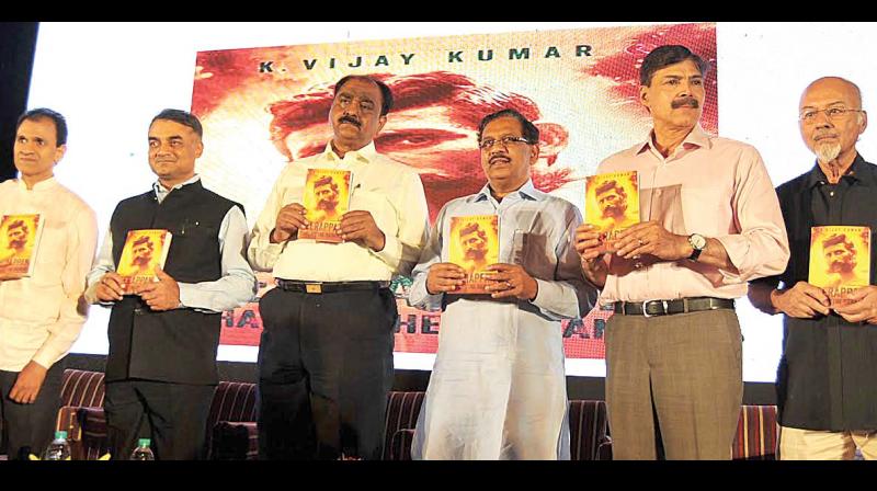 Actor and producer Raghvendra Rajkumar, DG & IGP R K Datta, former police officer Shankar M Bidari,  Home Minister G Parameshwar and  senior journalist T J S George (right) during the release of abook Veerappan- Chasing the Brigand, by former police officer K Vijay Kumar (second right) in Bengaluru on Friday.  (Photo: Shashidhar B)