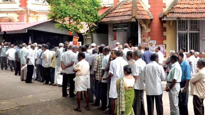 People queue up at Ernakulam sub-treasury in Kochi on Thursday. (Photo: SUNOJ NINAN MATHEW)