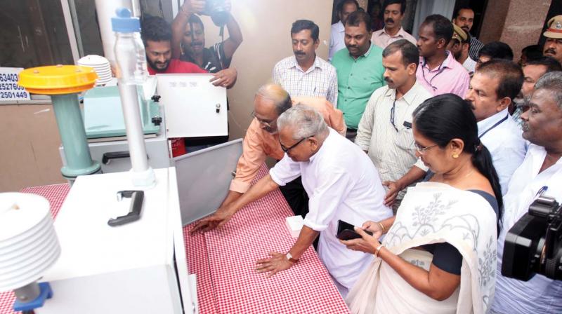 Former chief minister V. S. Achuthanandan inaugurates the mobile unit to check pollution at Kanjikode on Thursday. Minister K. K. Shailaja and others look on.    Arrangement