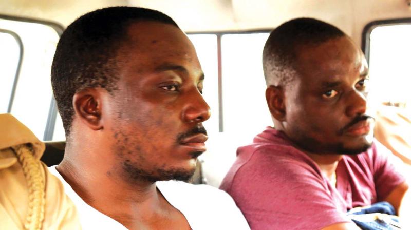 The accused Nigerians in police custody.  (Photo: DC)
