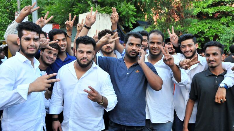 Mohammed Pahelwans son, family members and supporters show victory signs after the verdict, in Hyderabad on Thursday. 	(Photo: DC)